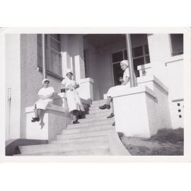 Nurses Sue Gardiner, Gloria Young, J Kerle on steps of Trumpy House, Ipswich Hospital, Ipswich, 1950s