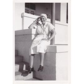 Nurse Lyn Berlin on steps Trumpy House, Ipswich Hospital, Ipswich, 1950s