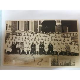Hospital Staff photo outside original building, 1930s
