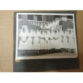 Nursing staff standing on the steps of the Sunshine Ward around Christmas, Ipswich Hospital, 1960s
