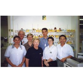 Pharmacy Staff, Back Row-Neville, Lynn Carl. Front Row-Rina, Sally, Angela, Bob, 1990s
