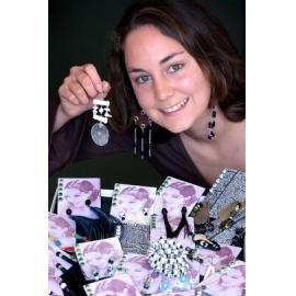 Ennette Cooper showing off her earring designs, Ipswich, September 2003