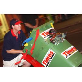 Wheelie bin racing event with participators Tim Everding, Stephen Austin, Russell and Kaisha Leigh, Queensland Times member and Ipswich's Own member race, and John Lewis and Brenden Webb with their billy cart, Ipswich, June 2003