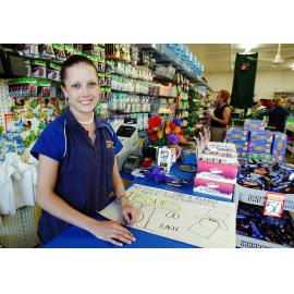 Unidentified woman working at a convenience store, Ipswich, June 2003