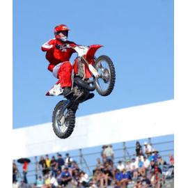 Motorcycle stunt riders entertaining spectators during racing break, Ipswich, June 2003