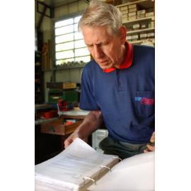 Hans Laroo going through a book, Ipswich, June 2003