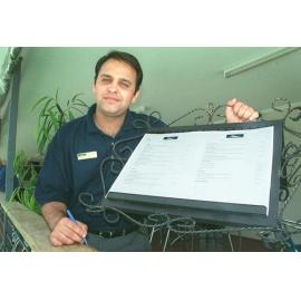 Unidentified man with a menu, Ipswich, February 2003