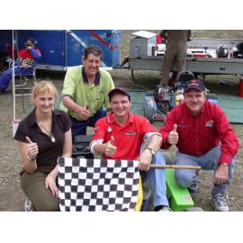 Councillor Cheryl Bromage, Mayor Paul Pisasale, Paul Casos and unidentified man with go-karts and racing gear, Ipswich, April 2003