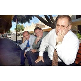 Paul Casos and two unidentified men waiting for the bus, Bell Street, Ipswich, April 2003