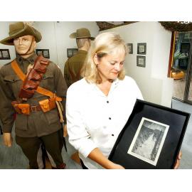 Inala Art Gallery Administration coordinator, Petronella Ryan contemplating life in the trenches with ANZAC displays, Inala, Brisbane, April 2003