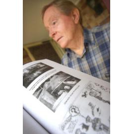 Author, Dr Noel Wallis with his book from the Wacol Army camp, Ipswich, April 2003