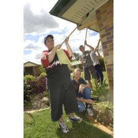 Cassie Power, Amanda, Adam O'Connell and Chris Dossel gardening and cleaning, Ipswich, November 2003