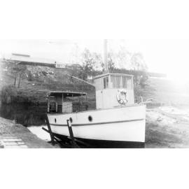 Eclipse (boat), owned by Percy Manders, in dry dock at slipway Blackall Street depot opposite Hancocks, c.1930s