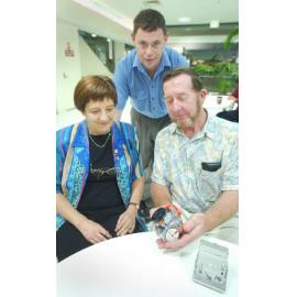 Ruth and Rob Fisher look at new camera ranges with help from Donavan Rickards of Heritage Photo, Ipswich, November 2003