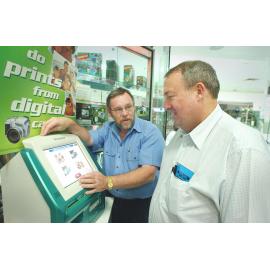 Owner of Heritage City Photos, Mike Rickards and President of the Ipswich Photographic Society, Wayne McDonnell at an information night at Heritage Photo, Ipswich, November 2003