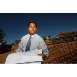 Naren Sinnathamby with construction plans, Springfield, Ipswich, August 2003