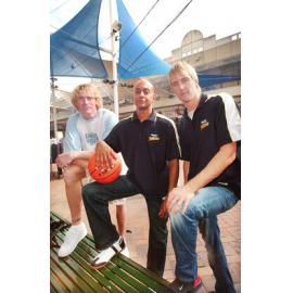 Three unidentified men from Brisbane Bullets basketball team, Ipswich Mall, Ipswich, August 2003