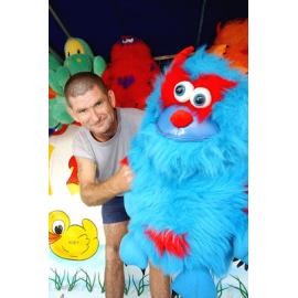 Unidentified man with prize toys at the Ipswich show, Ipswich, May 2003