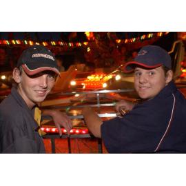 Two unidentified men watching an amusement park rides, Ipswich, May 2003
