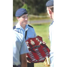 Thought to be named Mooney, holding an award from the Royal Australian Air Force, Ipswich, May 2003