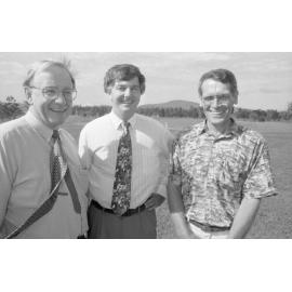 Three unidentified men standing in a paddock, Ipswich, March 1995