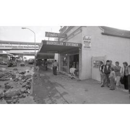 Crowd gathered outside of Brodies bookstore viewing the aftermath of the Reid's (Cribb & Foote) fire, Bell Street, Ipswich, August 1985