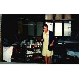 Domestic staff with tea trolley,