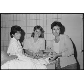 Three unidentified women working in Redbank Plaza Shopping Centre during construction, Redbank, September 1985