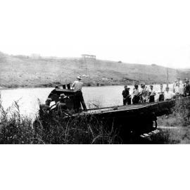 Luya Julius (truck) being pulled from Bremer River at Nicholas Street, Ipswich, by Percy Manders' truck, c.1935