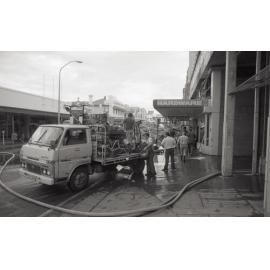 Removing stock from the hardware store, following the  Reid's (Cribb & Foote) fire, Bell Street, Ipswich, August 1985