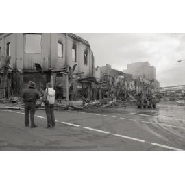 Police officers inspecting the aftermath of the Reid's (Cribb & Foote) fire, Bell Street, Ipswich, August 1985