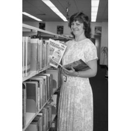 Unidentified staff member at Redbank Plaza Library shelving books, Redbank, September 1985