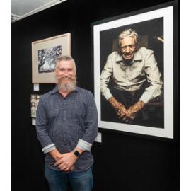 Jason McNamara with his portrait of former Ipswich Mayor John Nugent, Ipswich Art Awards, 2018