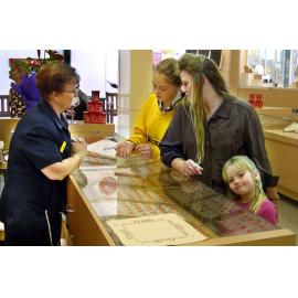 Dee Larson (staff), and Kara, Jenny, and Kori Blackwell at a jewelry store at Forest Lake Village, Ipswich, June 2004