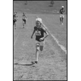 Unidentified Little Athletics Association event participant running, Ipswich, January 1986