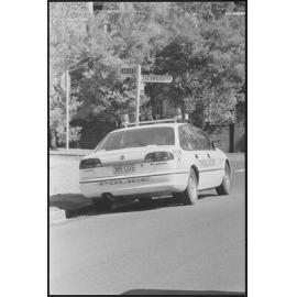 Police vehicle parked on the corner of Essex Court, Warwick Court, and Sherwood Crescent, Bellbird Park, Ipswich, 1st August 1994