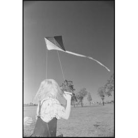 Unidentified girl flying kite, Ipswich region, 1st August 1994