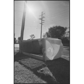 Vandalised Telstra public telephone booth, laying on its side, corner Briggs and Salisbury Road, Ipswich, 1st August 1994