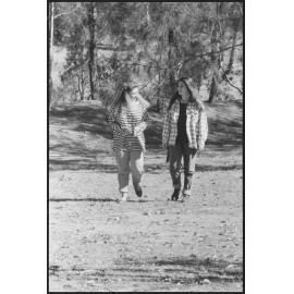 Two unidentified young women walking, location unknown, 1st August 1994