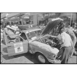 Men inspecting one of the vehicle entries in the Variety Bash, Nicholas Street Mall, Ipswich, 4th August 1994