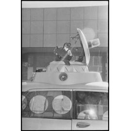 An alien, atop a vehicle that was taking part in the Variety Bash, Brisbane Street, Ipswich, 5th August 1994