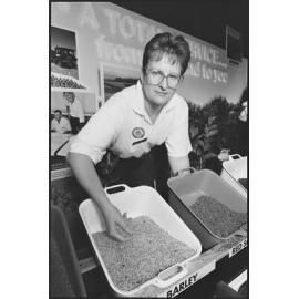 Queensland Forest Service representative Karen demonstrating at an education booth at the Ekka, Brisbane Showgrounds, Brisbane, 18th August 1994