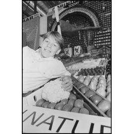 Unidentified boy with fruit display, Royal Queensland Show (Ekka), Brisbane Showgrounds, 18th August 1994
