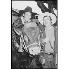 Two unidentified men with a winning show cow at the Ekka, Brisbane Showgrounds, Brisbane, 20th August 1994