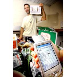 Paul Mitchell finds his new portable Pocket PC very useful for his small buisness NP's Fruit Workx, Ipswich, 17th January 2005 