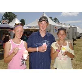 Jessica Hudson, Rueben Hudson and Laura Dux try and cool down with snow cones at Sonfest, Ipswich, 21st January 2005