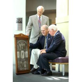 Image donor John Whitehead, Vice-President of Ipswich RSL Eddie Habben and donator of the frame Les Miller with the collection of images of WW1 soldiers who didn't return, Ipswich, 14th February 2005