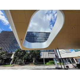 View of the Council Administration building, through the awning of Ipswich Central Library, Tulmur Place, Ipswich, March 2024