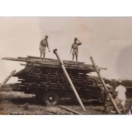 Don Risson's Ford helping to shift buildings to erect Camp Cal at Caloundra