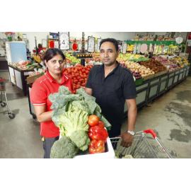 Devinder Singh with her brother in law Amarjit Singh at their family business Dinmore Fruit Barn where fruit and vegetable stocks are low and expensive because of the recent flooding, Ipswich, 6th January 2011